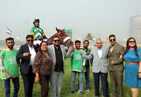 Pride`s Prince (Mustakim Alam), winner of Rusi Patel Trophy being led in by the winning connections along with trainer Trainer Imtiaz A Sait at Mumbai on Sunday.